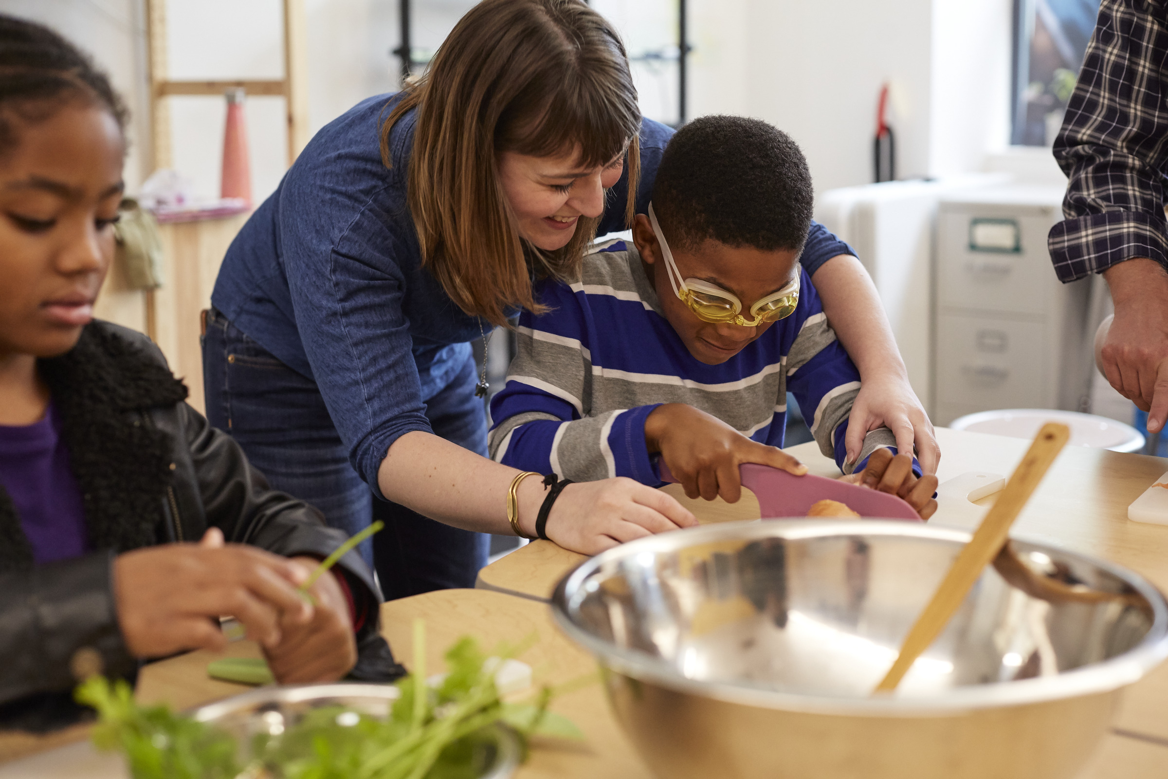 Teacher helping student
